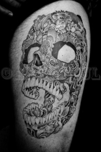 Graphic Skull Thigh Tattoo